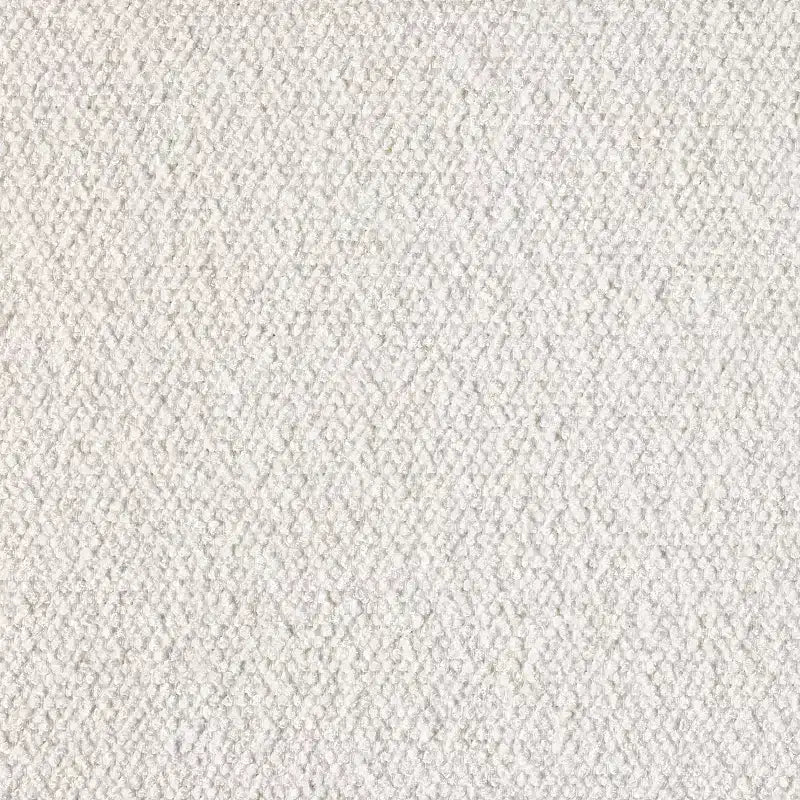 Sillón decorativo tapizado en bouclé con detalles de latón
